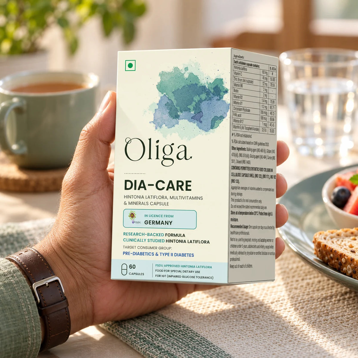 Hand holding the Oliga Dia-Care pack at breakfast